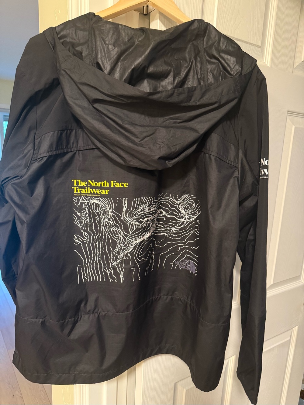 The North Face Black Trailwear Hooded Rain Jacket with Graphic Back